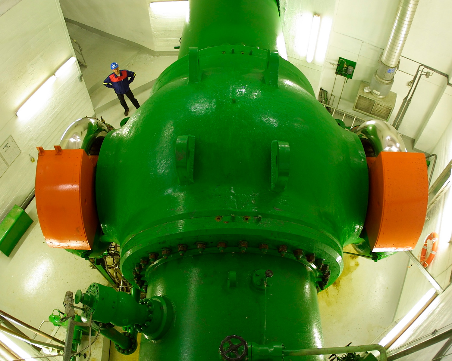 Ball valve regulating water flow into turbine at Sima power plant.